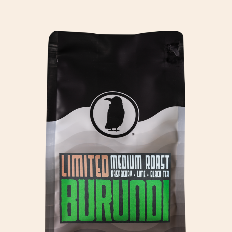 Rook Coffee bag with ' Limited Burundi' branding and "medium roast, raspberry, lime, black tea" on the label on a beige background.