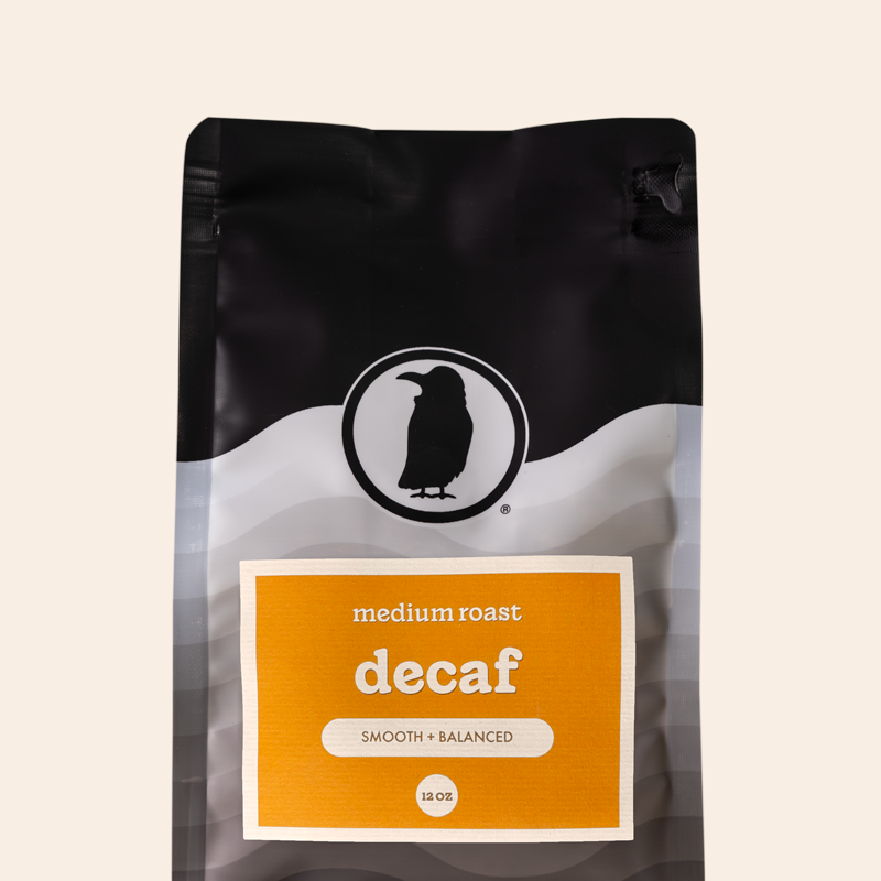 Packaging of a 12-ounce bag of medium roast decaf coffee labeled 'Decaf, Smooth + Balanced," featuring the Rook Coffee logo at the top. 