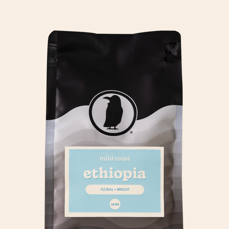 Packaging of a 12-ounce bag of mild roast coffee labeled 'Ethiopia, Floral + Bright,' featuring the Rook Coffee logo at the top. 