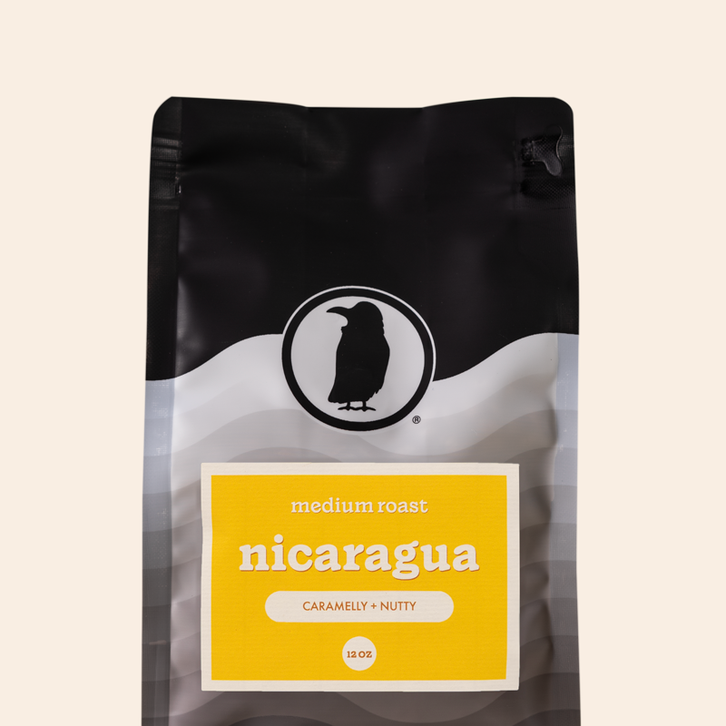 Packaging of a 12-ounce bag of medium roast coffee labeled 'Nicaragua, Caramelly + Nutty,' featuring the Rook Coffee logo at the top. 