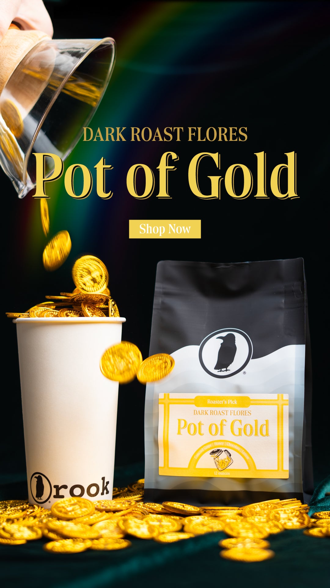 A mobile-friendly promotional banner for 'Pot of Gold' dark roast coffee. The image features a black and white coffee bag with a gold and white label, placed next to a branded Rook Coffee cup overflowing with gold coins. Additional gold coins appear to be pouring from a glass container above, with a faint rainbow visible in the dark background. The text 'Dark Roast Flores' and 'Pot of Gold' is prominently displayed in bold golden letters, along with a 'Shop Now' button.