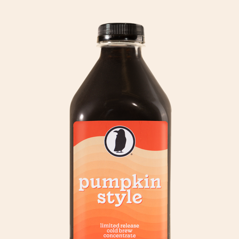 A bottle of Rook Coffee's Pumpkin Style cold brew concentrate with an orange gradient label.