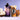 Bottle of Rook Coffee Coconut Vanilla Style cold brew concentrate beside a Rook branded cup of cold brew swirled with cream. Halved coconuts and coconut flakes surround the drinks against a soft purple background, highlighting the coconut-inspired flavor.