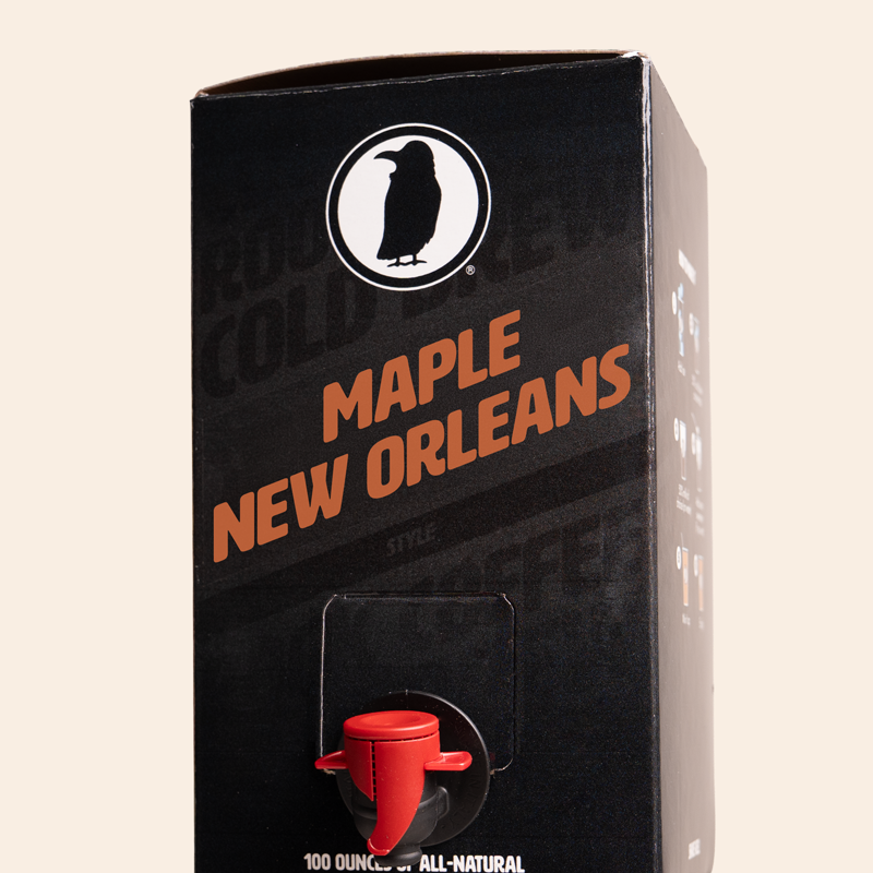 Black 100 brew box with 'Maple New Orleans' text and a red tap dispenser on a beige background.