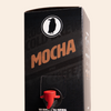 Boxed Rook Coffee cold brew with a black package, brown ‘Mocha’ text, and the Rook Coffee bird logo near the top. A red dispensing spout is visible on the front.