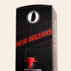 Boxed Rook Coffee cold brew with a black package, red ‘New Orleans’ text, and the Rook Coffee bird logo near the top. A red dispensing spout is visible on the front.