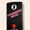 Boxed Rook Coffee cold brew with a black package, pink ‘Strawberry Mocha’ text, and the Rook Coffee bird logo near the top. A red dispensing spout is visible on the front.