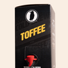 Boxed Rook Coffee cold brew with a black package, yellow ‘Toffee’ text, and the Rook Coffee bird logo near the top. A red dispensing spout is visible on the front.