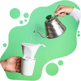 Hand pouring hot water from a gooseneck kettle into a ceramic pour-over coffee dripper held above a matching mug, against a green background with abstract shapes.