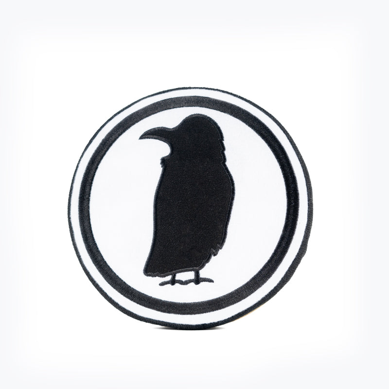 A plush dog toy shaped like the Rook Coffee logo