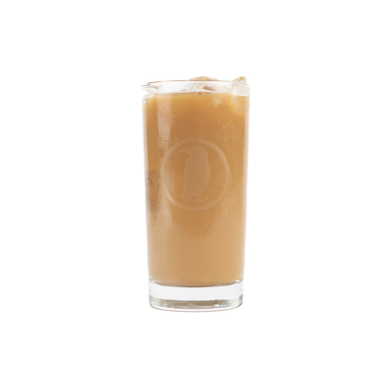 A tall glass with the Rook Coffee bird logo etched in gray