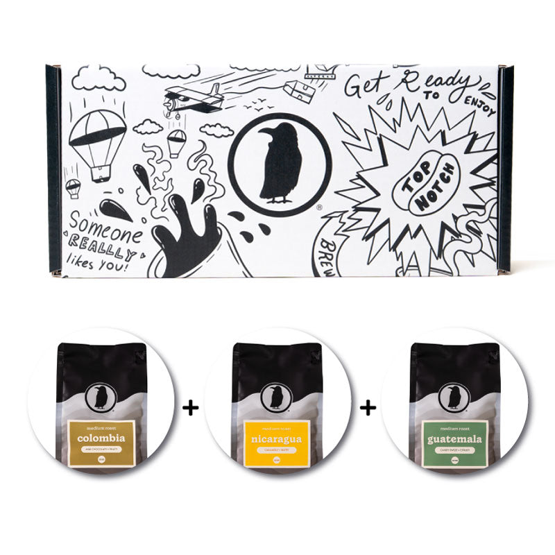 Rook-branded gift box with three bags of Rook Coffee below.
